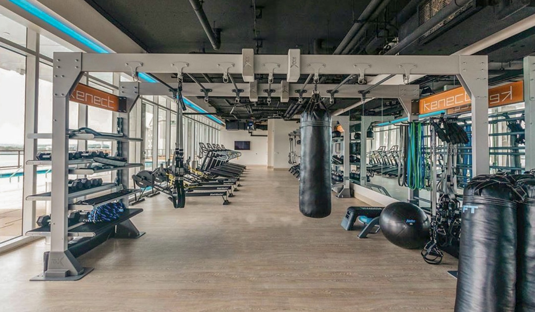 Gym Rax Bridge with Aktiv Virtual Bays and stairmaster rowers and ecore gym flooring used in Kenect Nashville fitness center