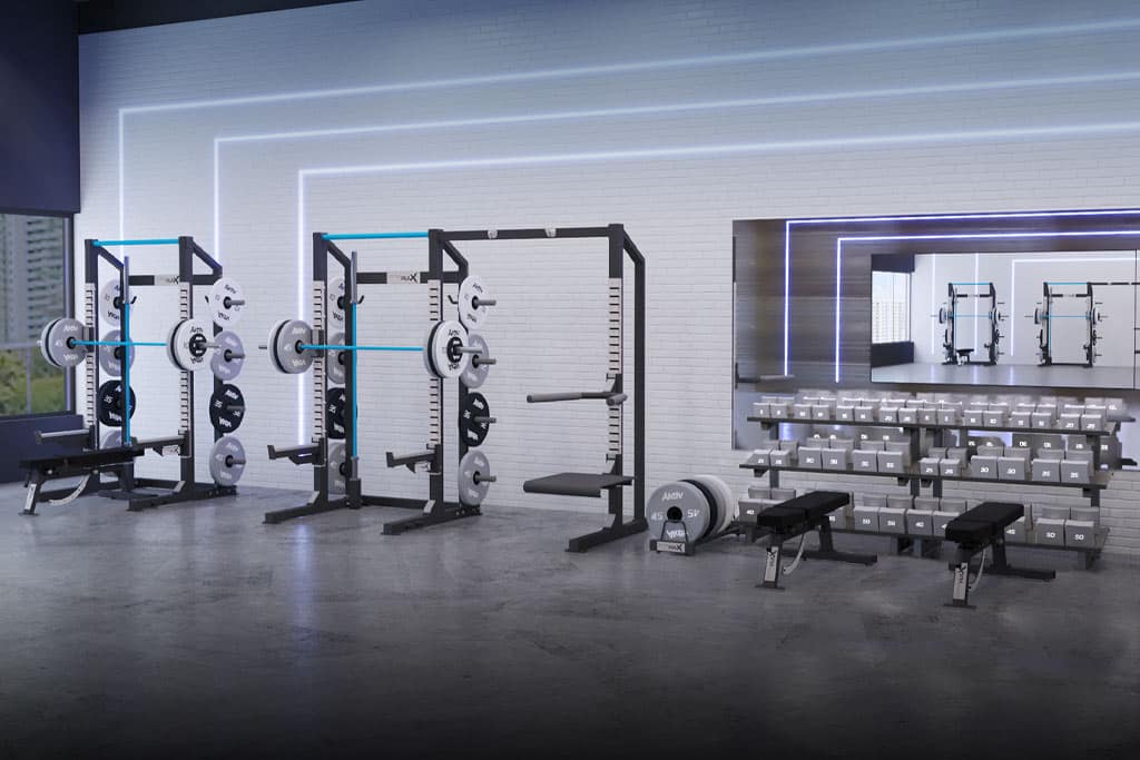 Two squat racks and a free weight strength training area with dumbbells and two benches.