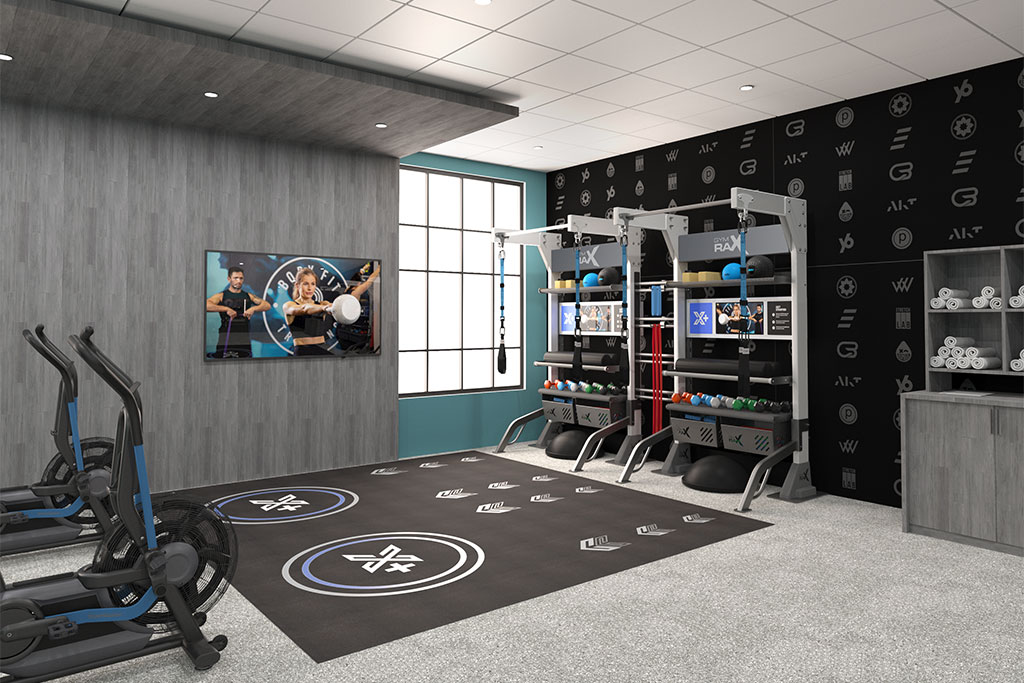 Double Xponential+ Training Bays with digital exercise guidance on the wall and gym flooring.