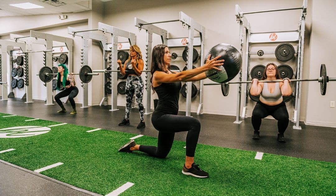 Women working out in a gym designed for strength training.