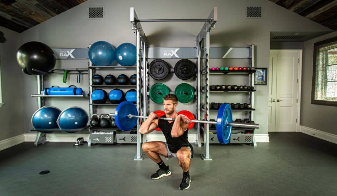 Man working out in gym designed with strength training.