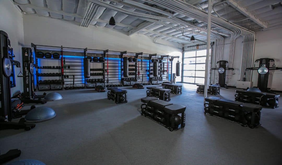 A gym designed with functional storage to create a clean space for its members. 