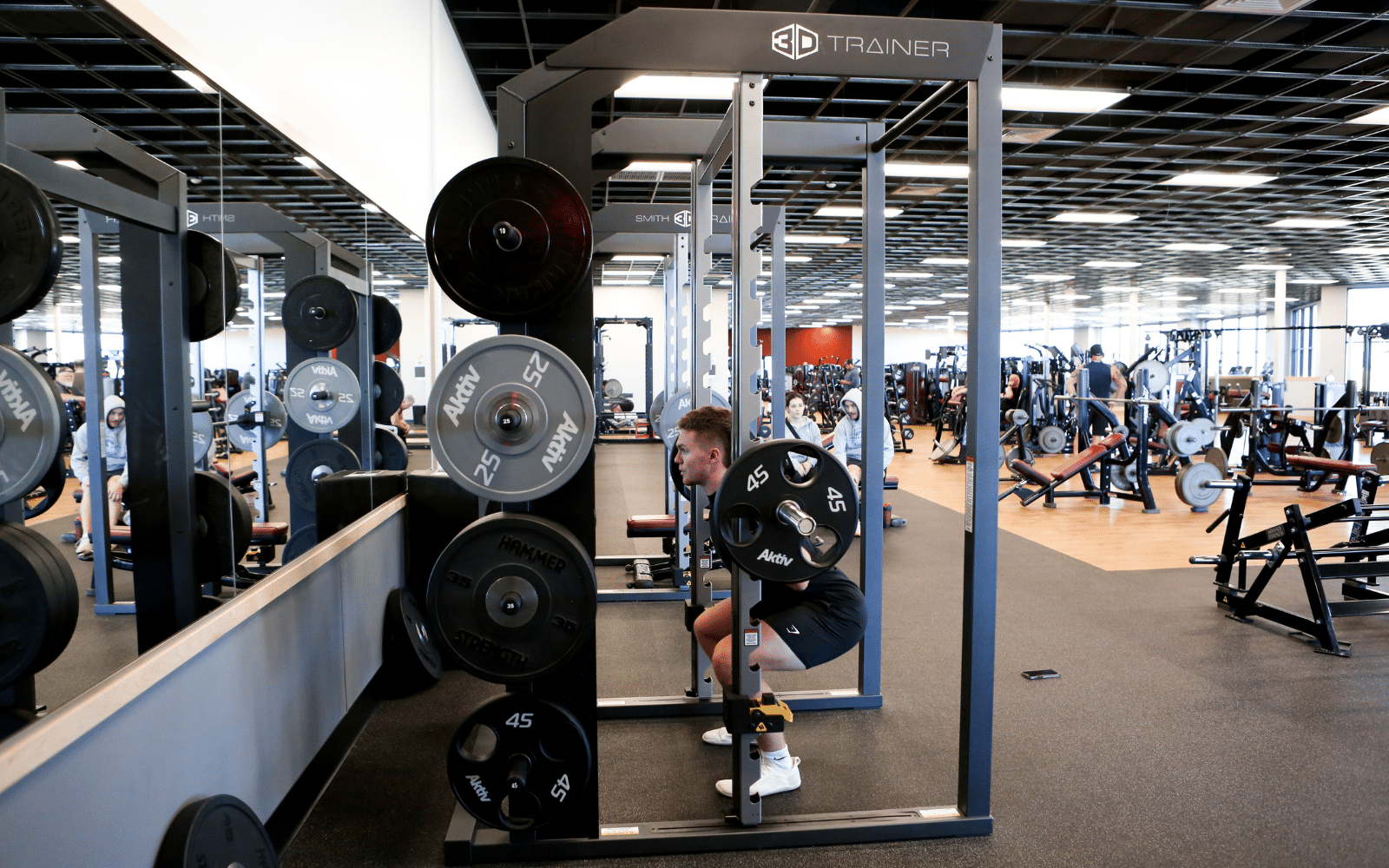 peak health club squats on smith machine by gym rax